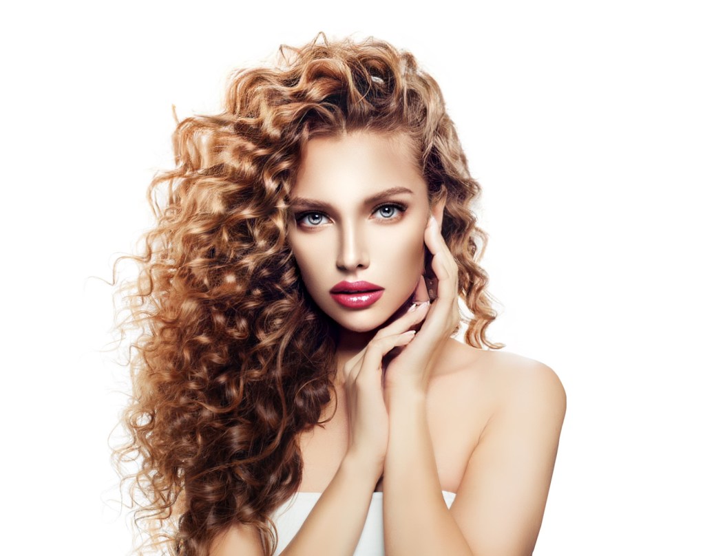 Long beautiful red curls - Body wave Beautiful fair skin woman grey eyes and red lips. Red hair with long curls. Curls overview and selection blog at www.WigMakingBlog.com